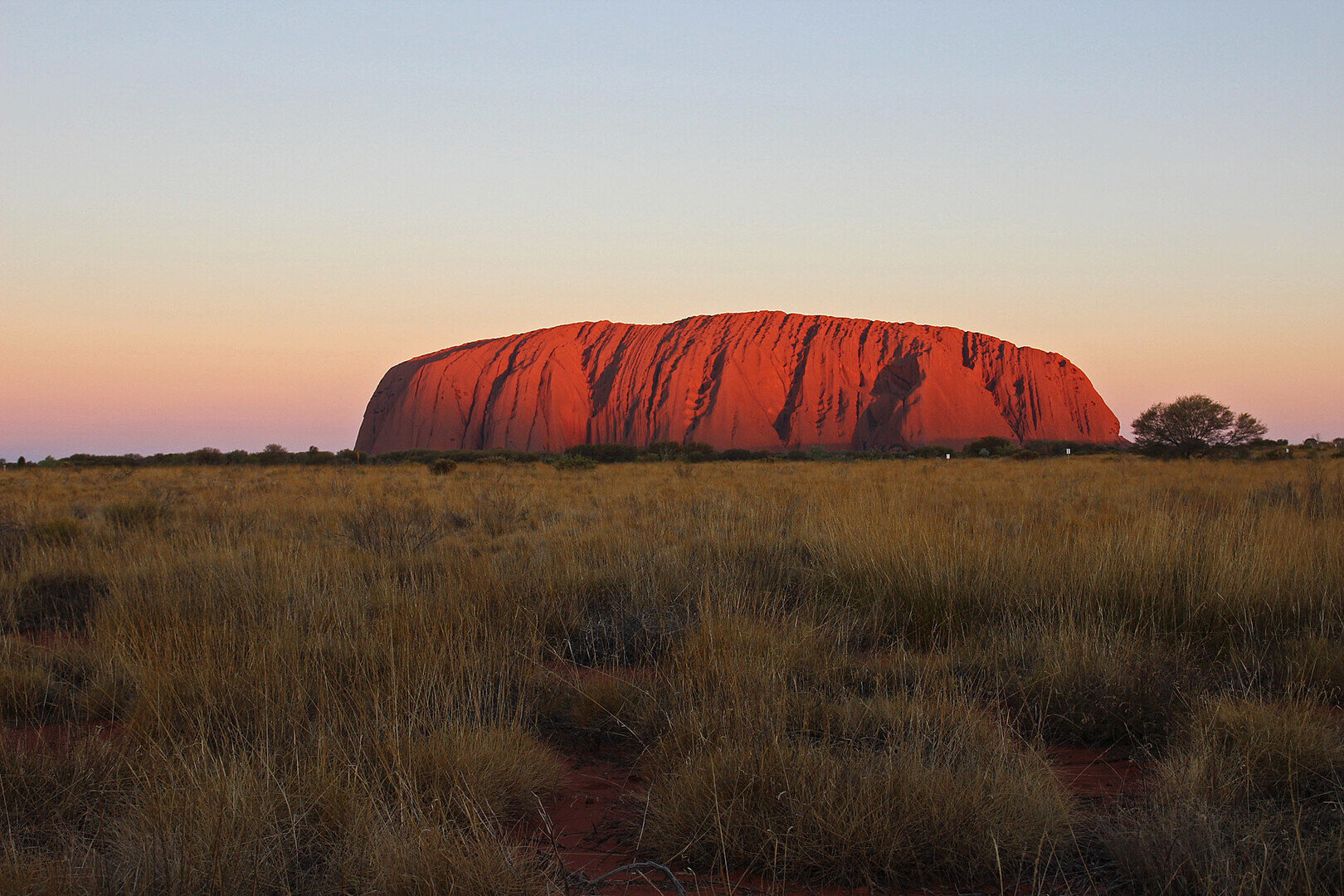 Uluru sacred monolith rising from Australian desert